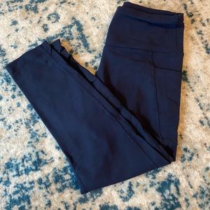 Navy blue cropped leggings with side pockets